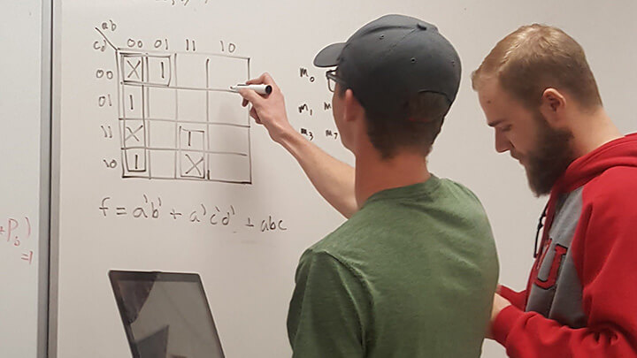 Math & Stats Center tutor helps a student